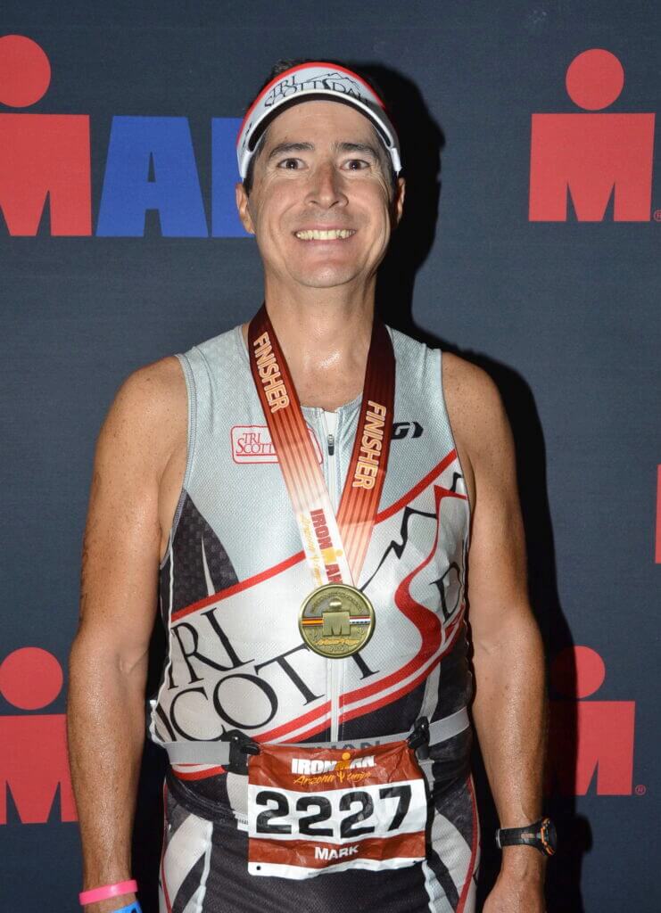 Mark Martz finishes another race. He works to help improve the health initiatives of Arizona Communities